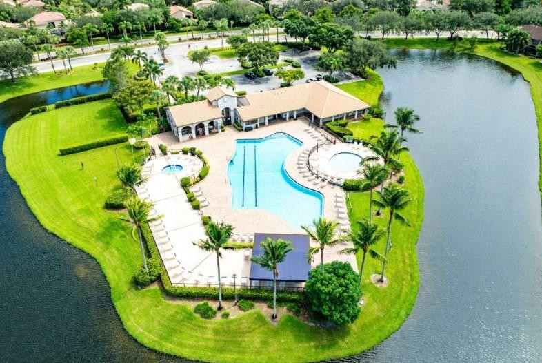 10761 Northwest 14th Street, Unit 281 Plantation, FL 33322 - Photo 33 of 33 an aerial view of a swimming pool with outdoor seating and yard
