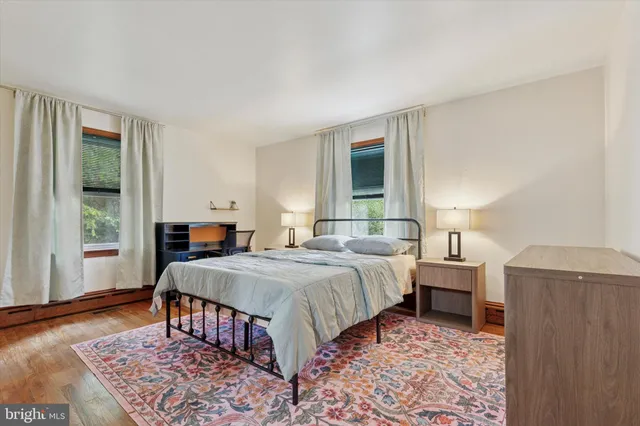 a bed room with a bed and a window