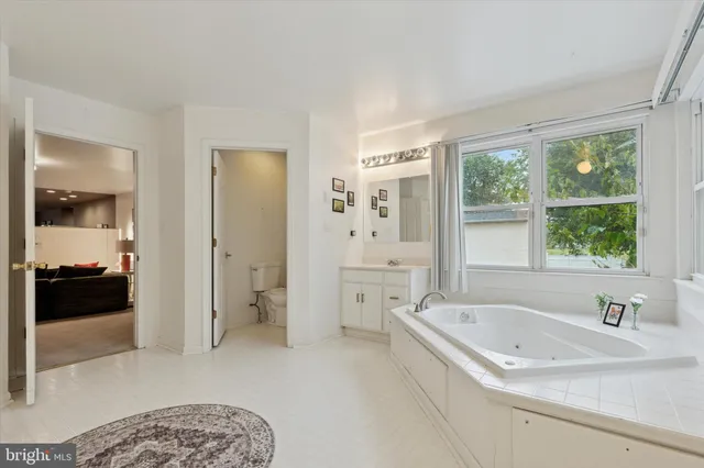 a bathroom with a bathtub and a sink