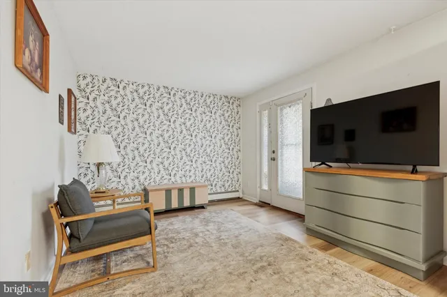 a living room with a couch and a flat screen tv