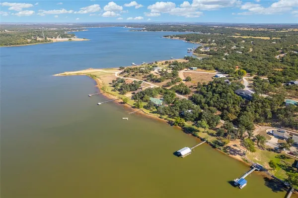 an aerial view of a house with a lake view