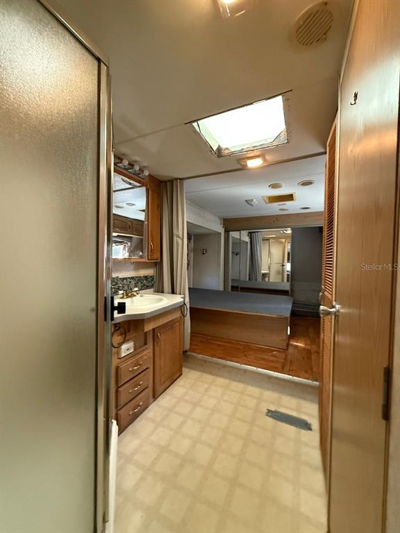 3000 Clarcona Road, Unit 419 Apopka, FL 32703 - Photo 6 of 12 a bathroom with a tub sink shower and mirror