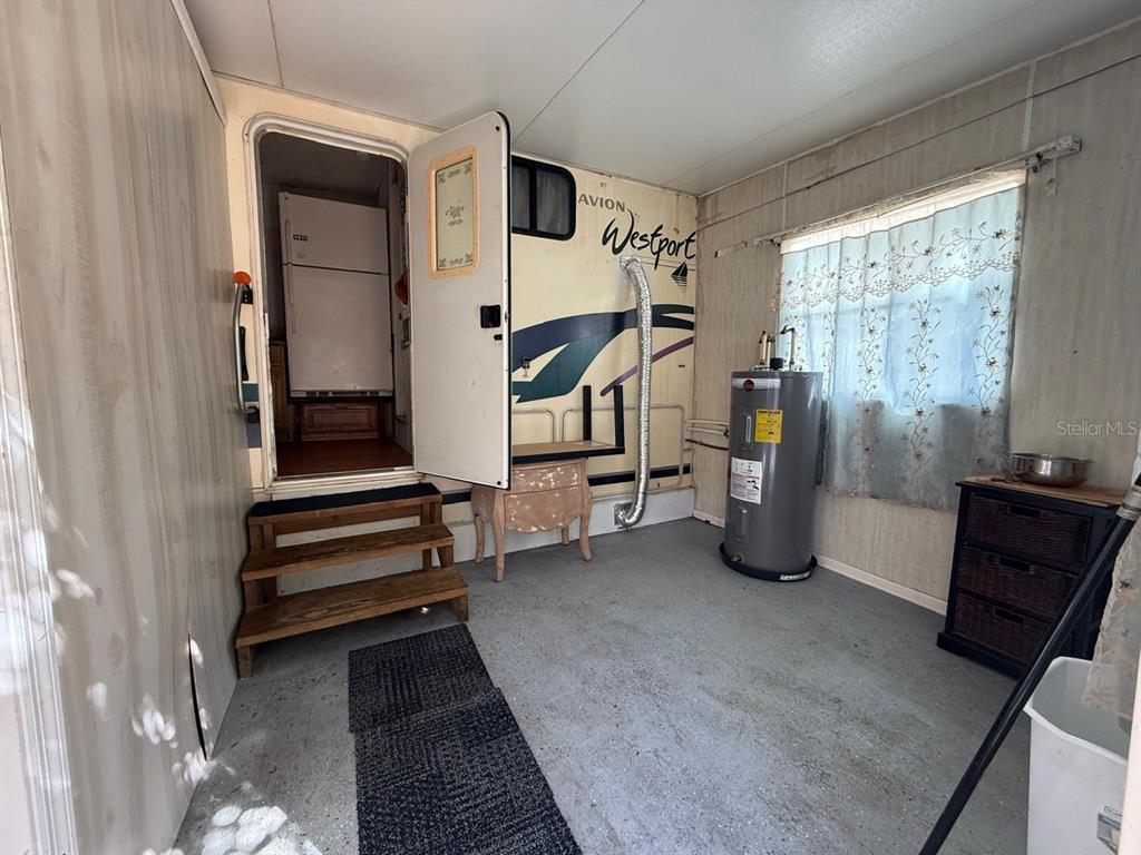 3000 Clarcona Road, Unit 419 Apopka, FL 32703 - Photo 8 of 12 a view of an empty room with a window