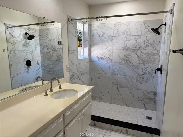 a view of a chairs and table in the balcony