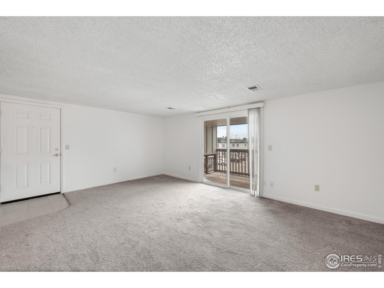 1817 26th Street Greeley, CO 80631 - Photo 11 of 29 a view of an empty room with a window
