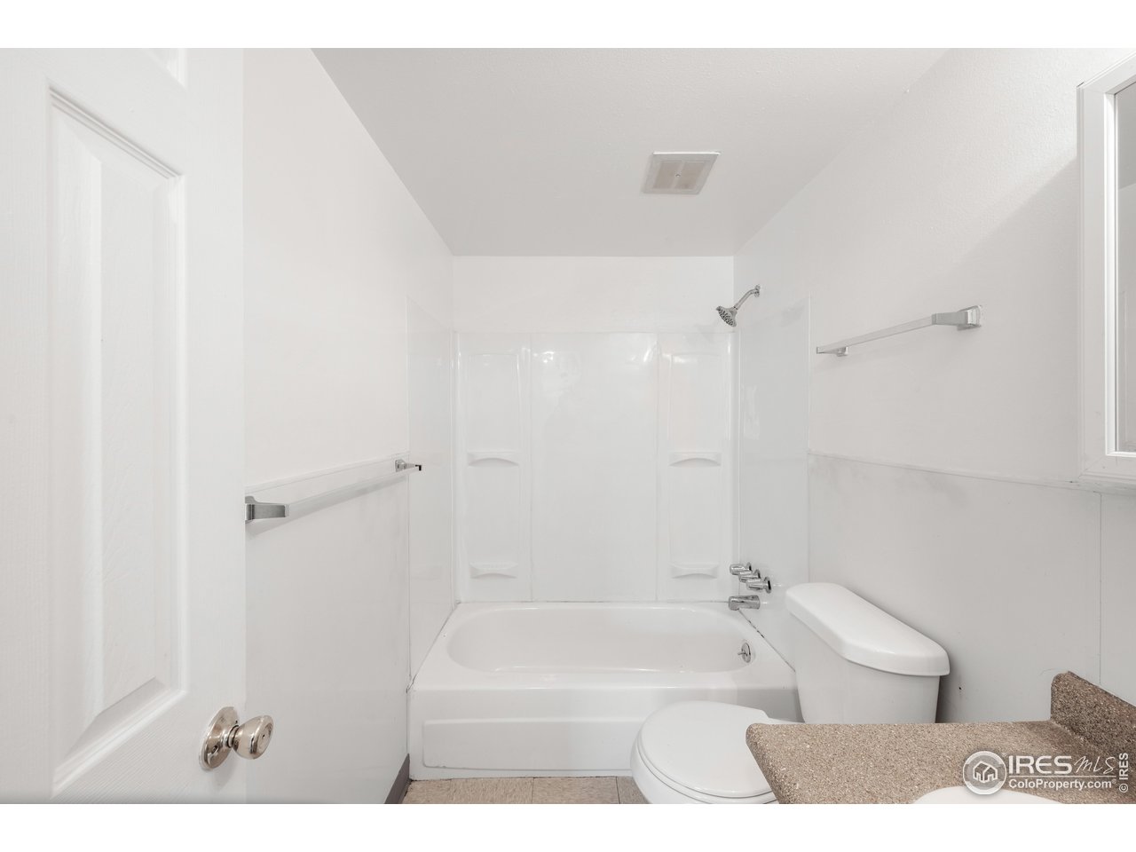1817 26th Street Greeley, CO 80631 - Photo 14 of 29 a bathroom with a bathtub and shower