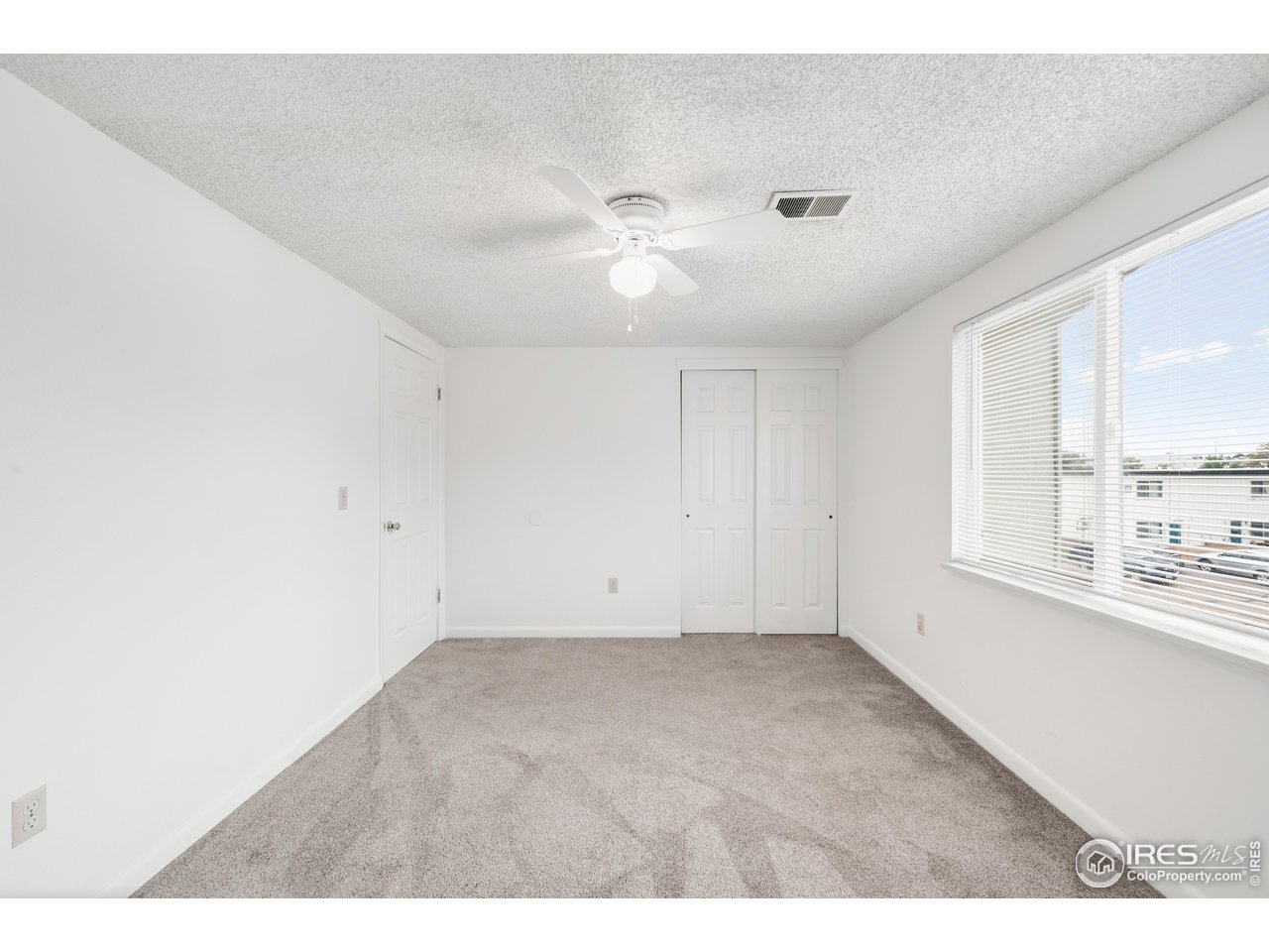 1817 26th Street Greeley, CO 80631 - Photo 17 of 29 a view of an empty room with a window