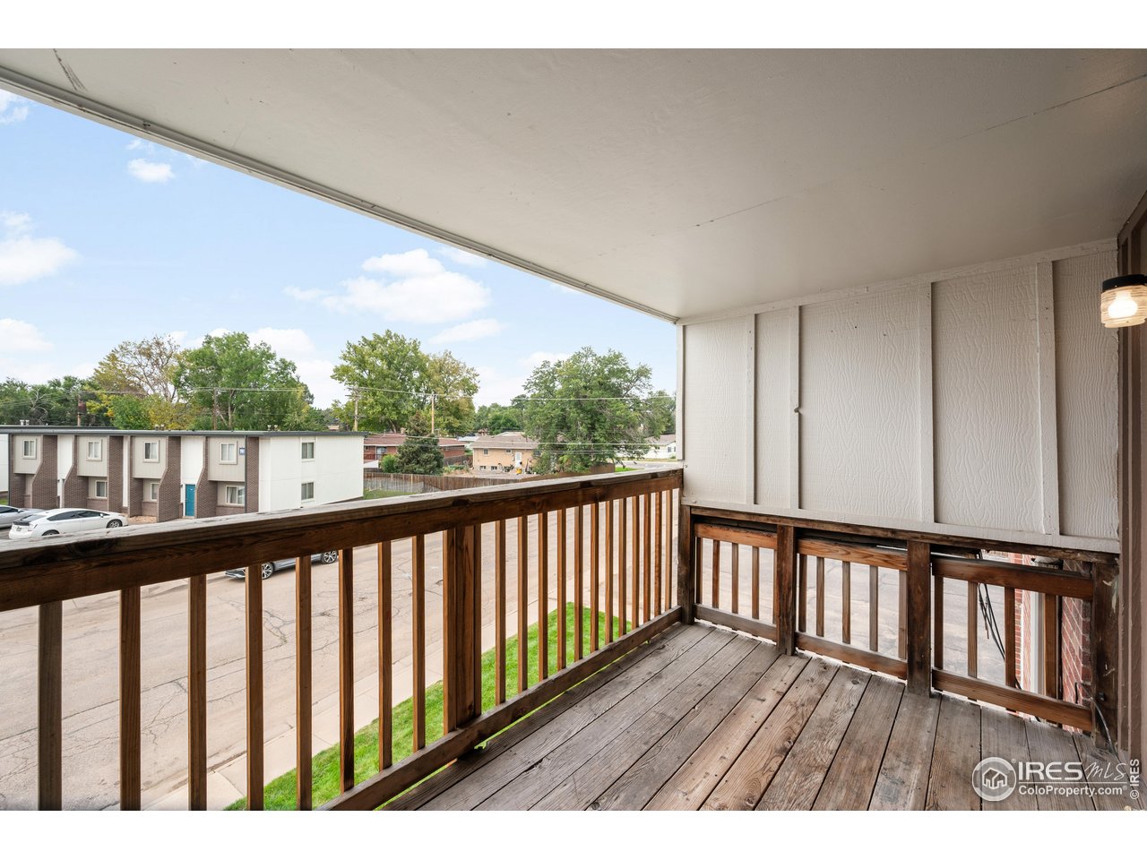 1817 26th Street Greeley, CO 80631 - Photo 20 of 29 a view of balcony with wooden floor