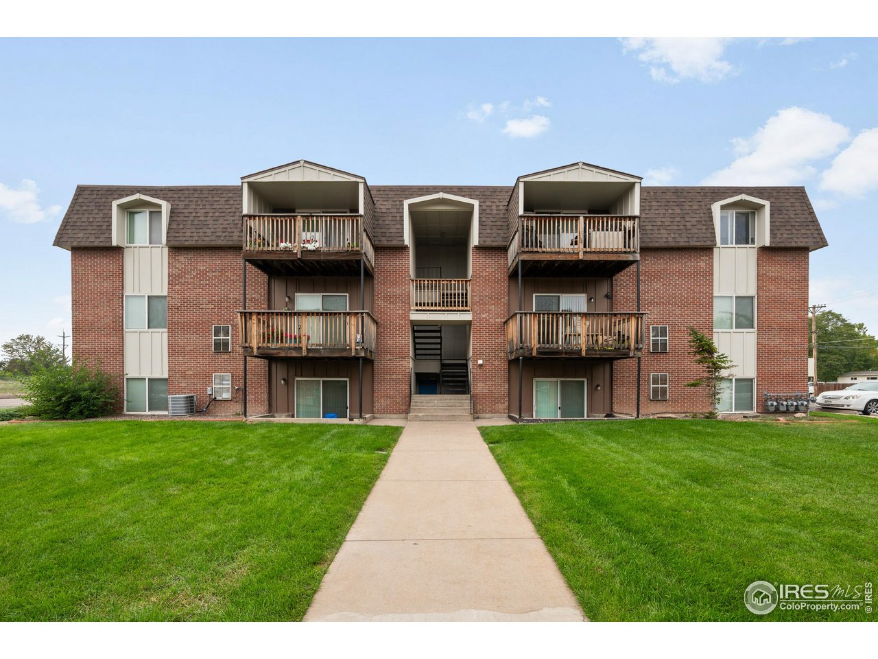 1817 26th Street Greeley, CO 80631 - Photo 2 of 29 a front view of building with yard
