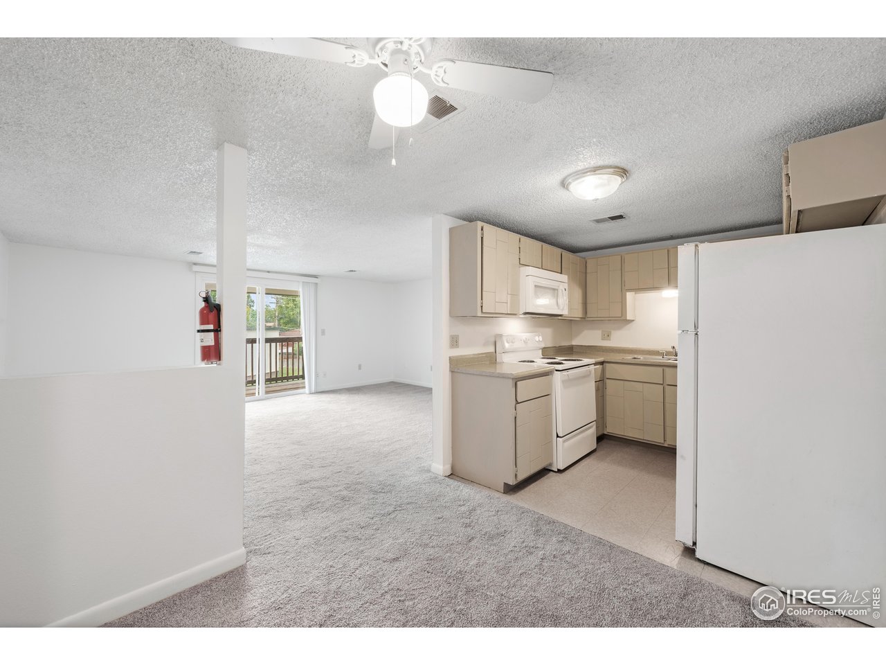 1817 26th Street Greeley, CO 80631 - Photo 26 of 29 a kitchen with cabinets and window
