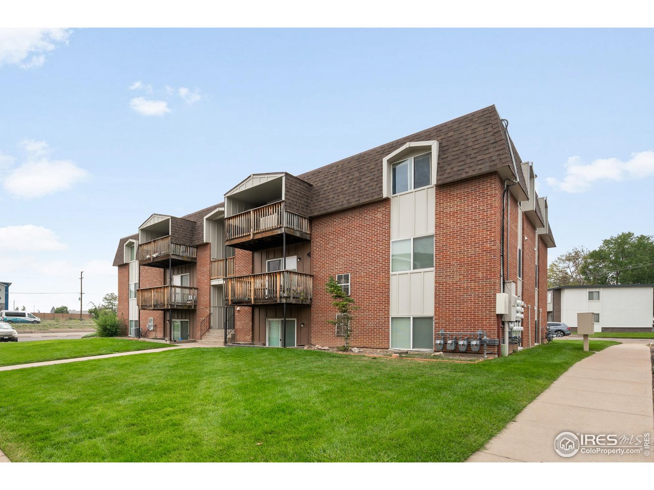 1817 26th Street Greeley, CO 80631 - Photo 3 of 29 a backyard of a house with lots of green space