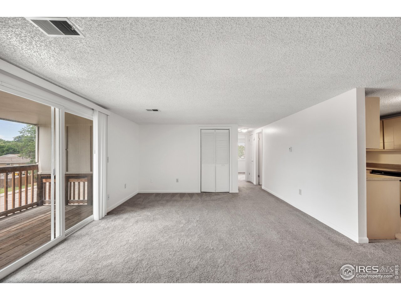 1817 26th Street Greeley, CO 80631 - Photo 6 of 29 a view of an empty room with a window