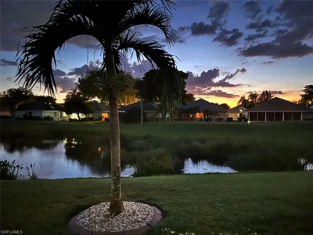 a swimming pool with outdoor seating and yard