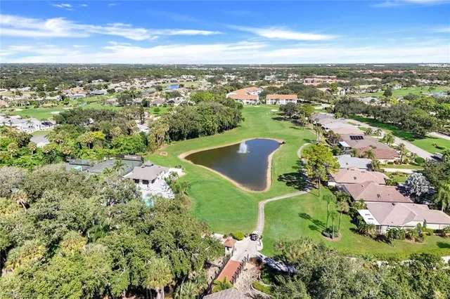an aerial view of a houses with a yard