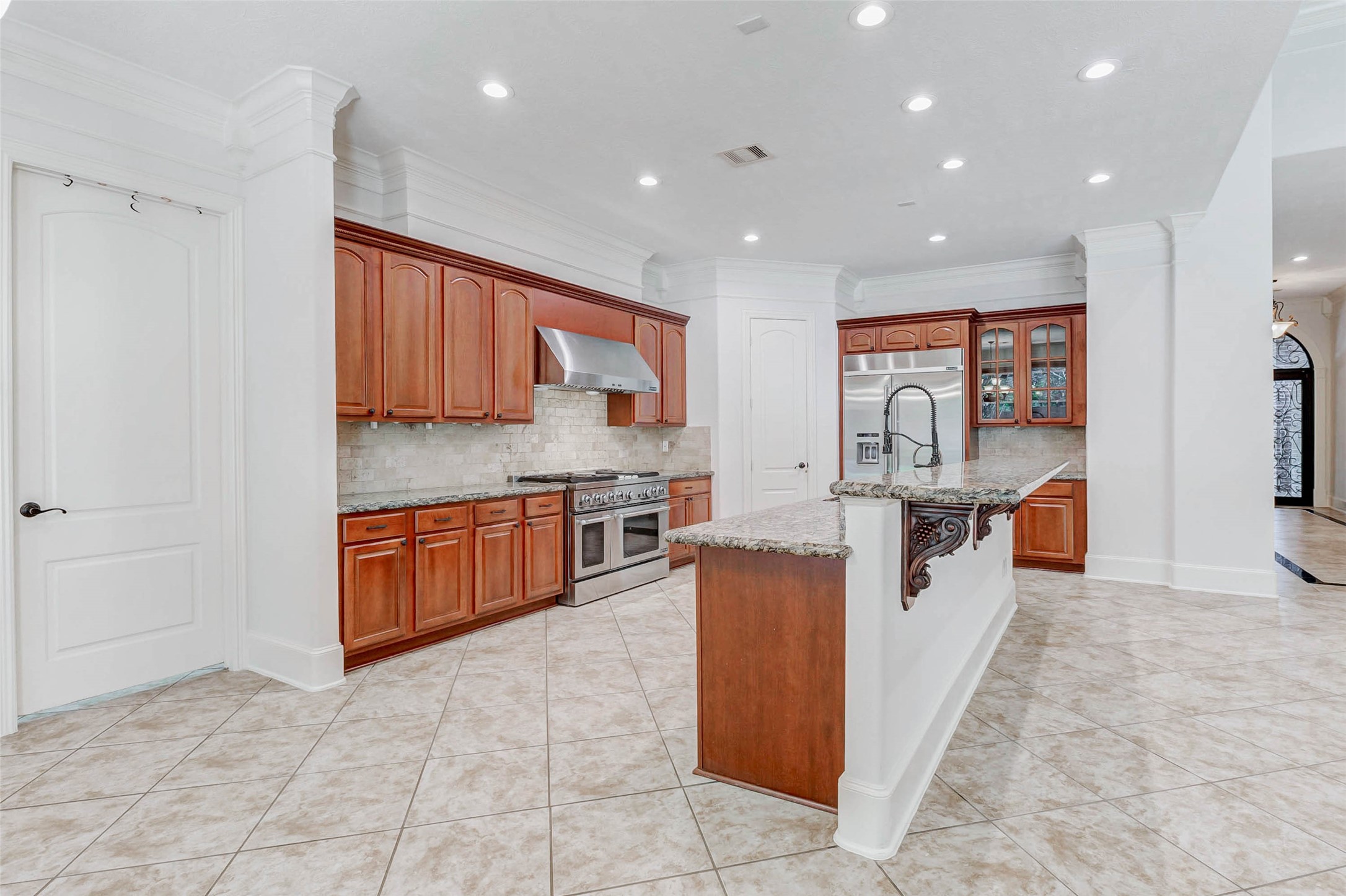 3509 Mirror Court Spring, TX 77388 - Photo 12 of 45 This well-appointed kitchen offers abundant cabinetry, granite countertops, and a stunning backsplash. You also have double crown molding and recessed lighting.