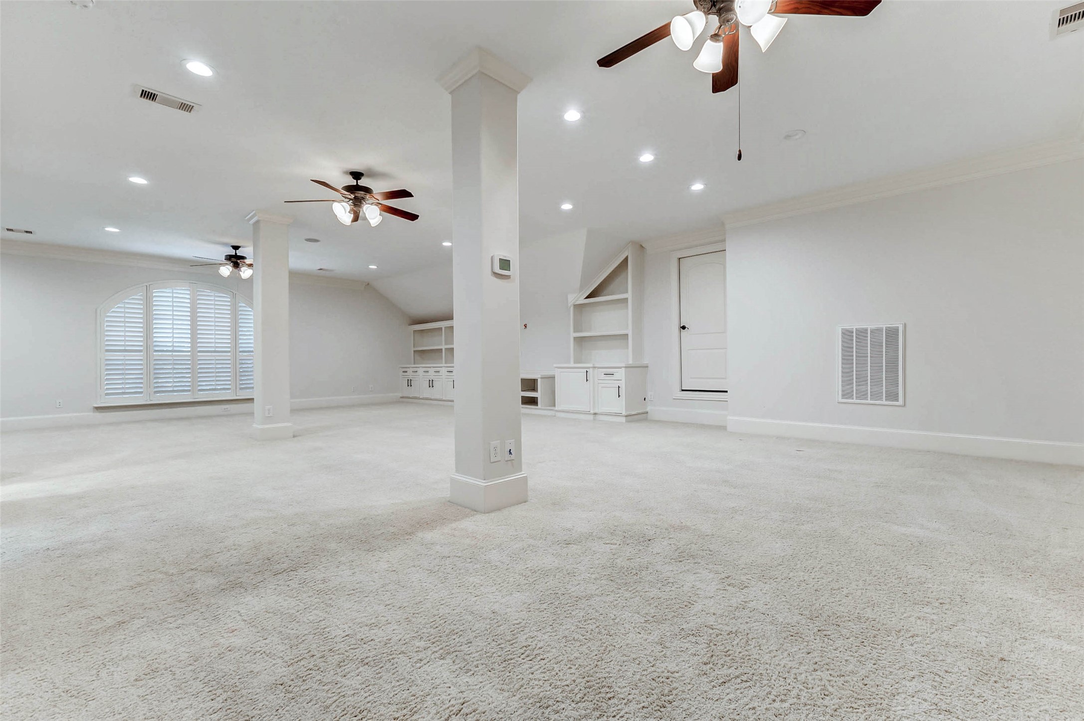 3509 Mirror Court Spring, TX 77388 - Photo 26 of 45 The expansive upstairs game room offers endless possibilities, featuring plush carpeting, recessed lighting, and multiple ceiling fans for added comfort.