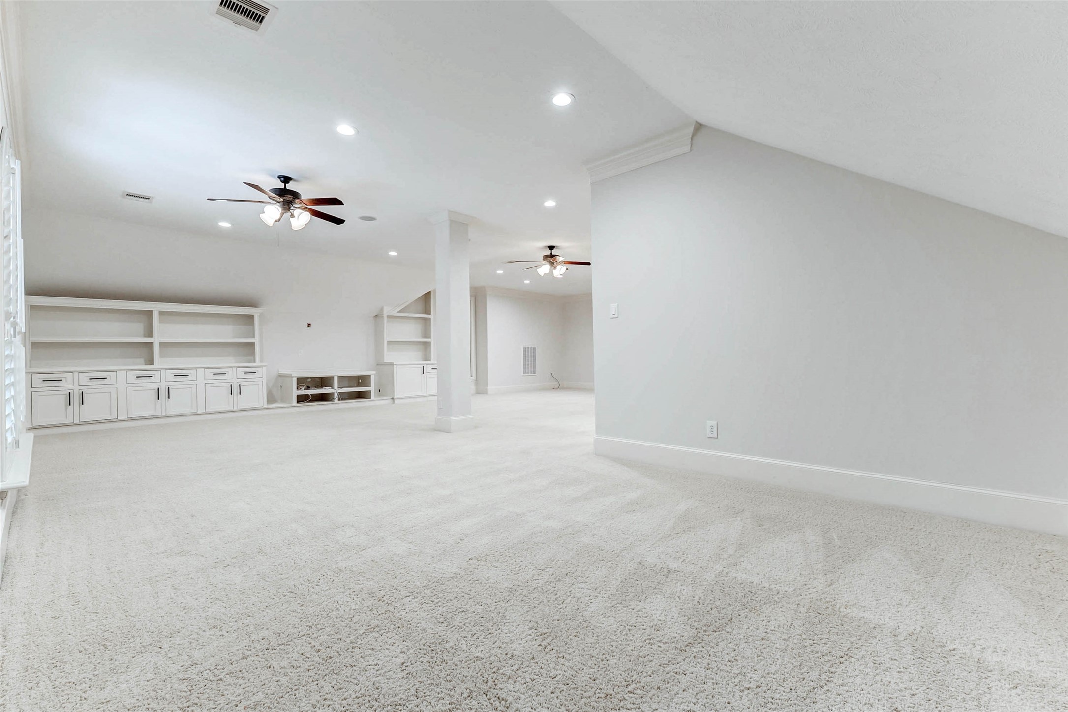 3509 Mirror Court Spring, TX 77388 - Photo 27 of 45 Built-in cabinetry and shelving provide excellent storage, while large windows with plantation shutters bring in natural light to create a bright and versatile living space.