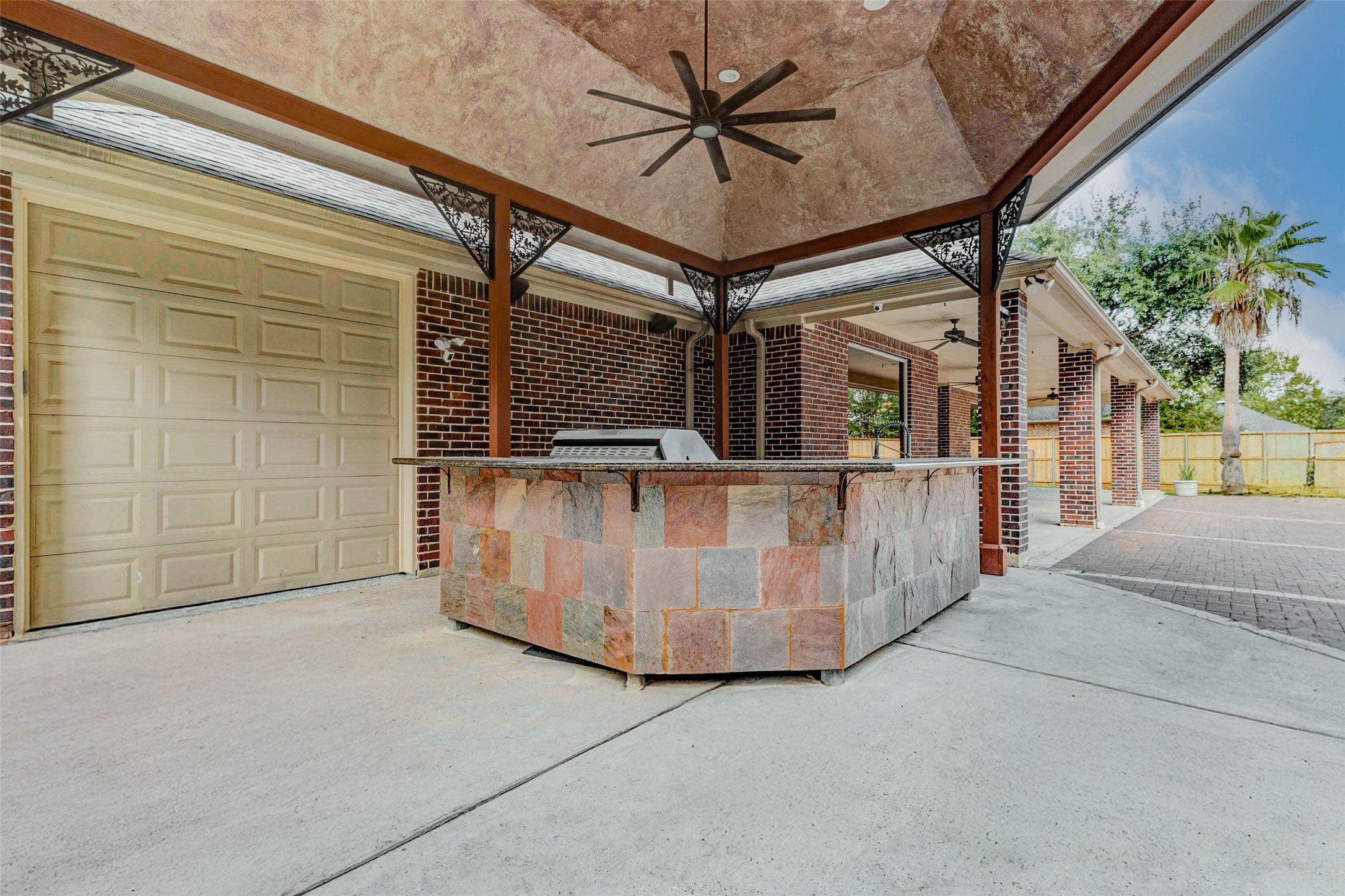 3509 Mirror Court Spring, TX 77388 - Photo 37 of 45 The outdoor kitchen sits just steps away from a convenient garage passthrough door, making it easy to bring supplies in and out from the garage. This is especially great for your lawn mower and landscaping equipment.
