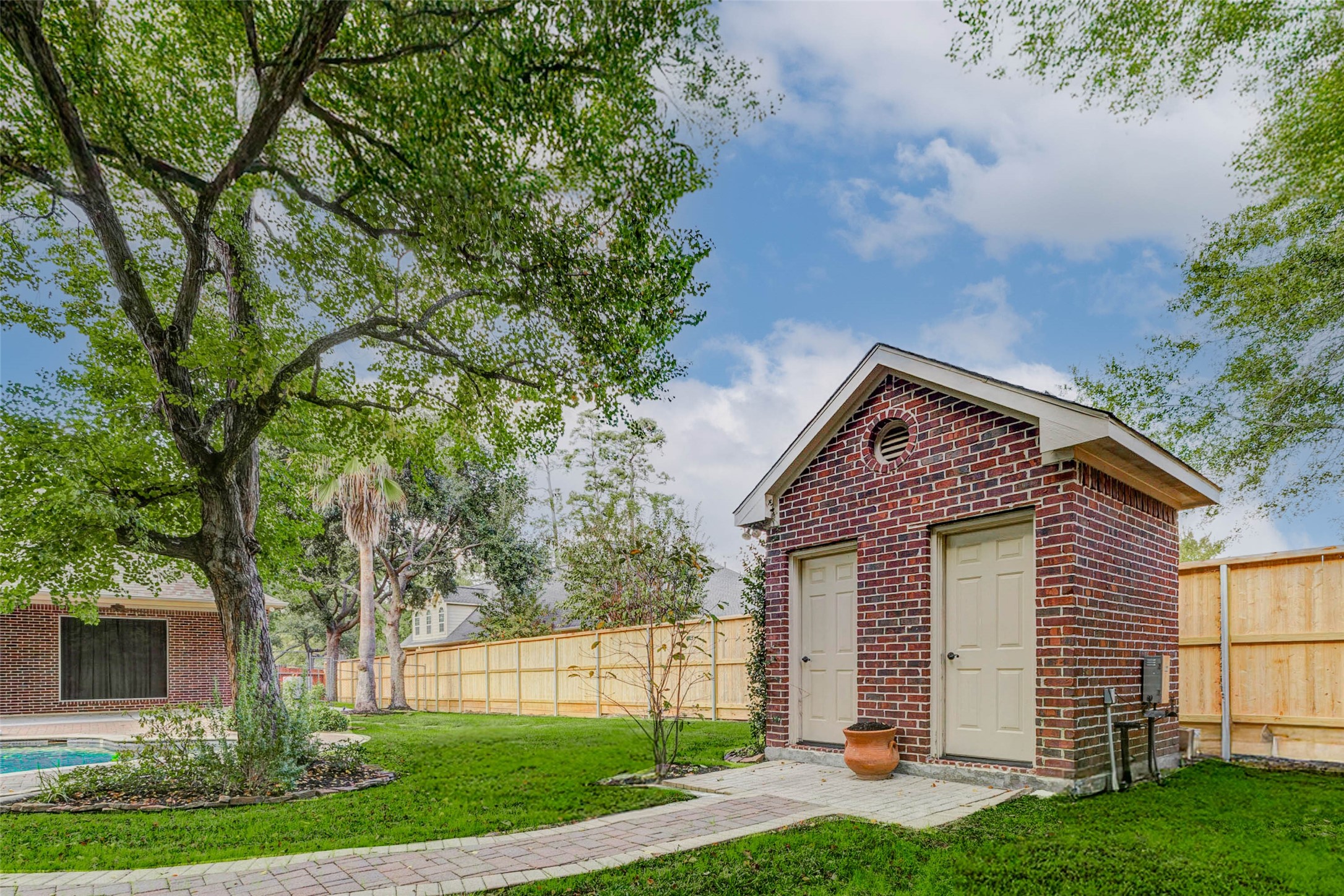 3509 Mirror Court Spring, TX 77388 - Photo 38 of 45 A charming brick outbuilding provides valuable extra storage and has its own powder room with a toilet and sink.