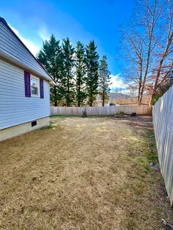 a view of a yard with an outdoor space