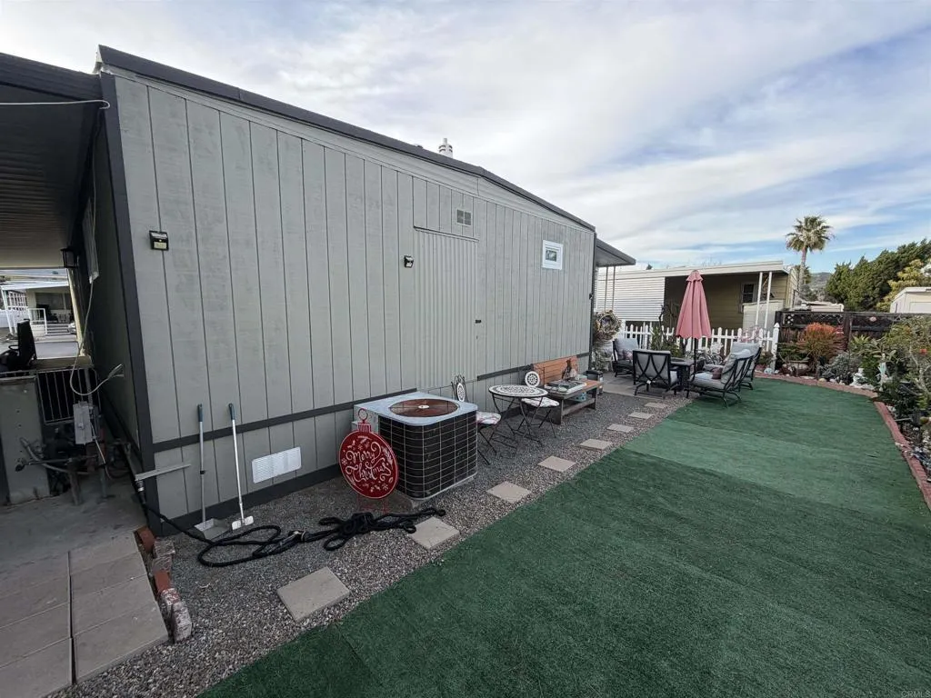 8301 Mission Gorge Road, Unit 162 Santee, CA 92071 - Photo 36 of 65 a backyard of a house with table and chairs