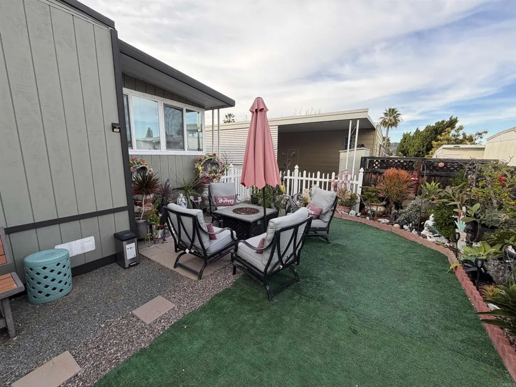 8301 Mission Gorge Road, Unit 162 Santee, CA 92071 - Photo 37 of 65 a view of a house with backyard and sitting area