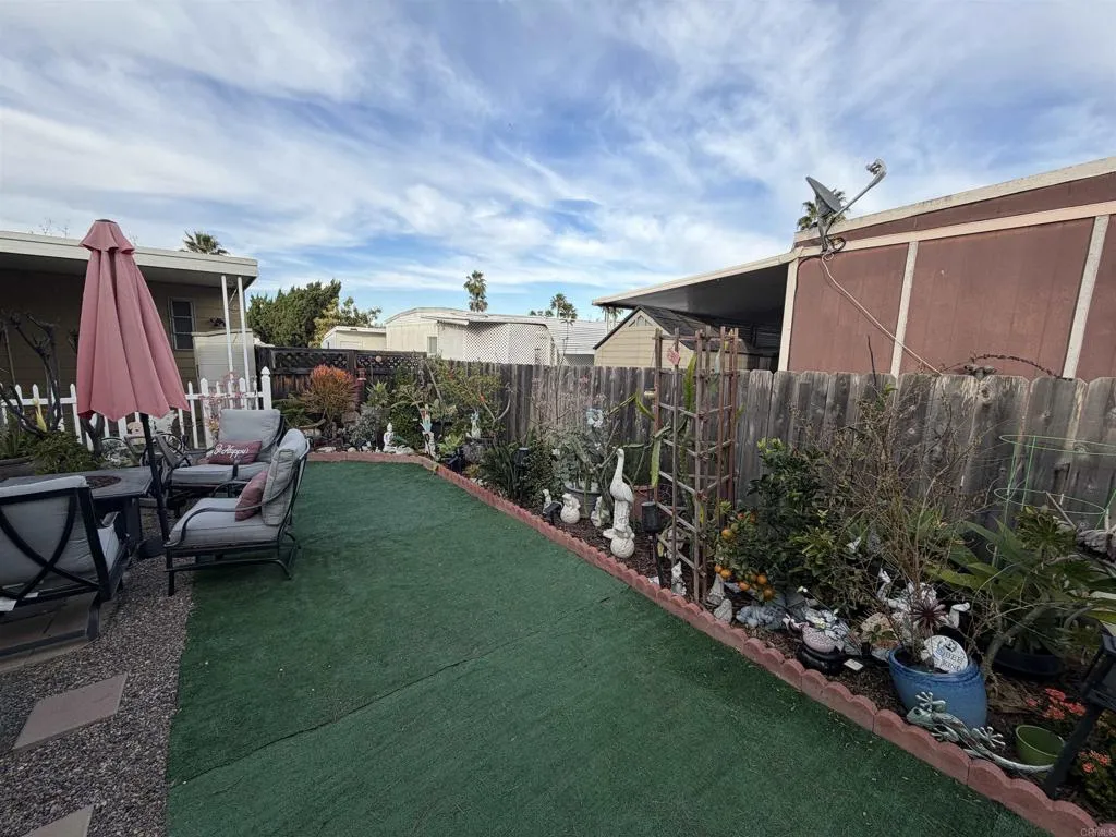 8301 Mission Gorge Road, Unit 162 Santee, CA 92071 - Photo 39 of 65 a view of a backyard with sitting area
