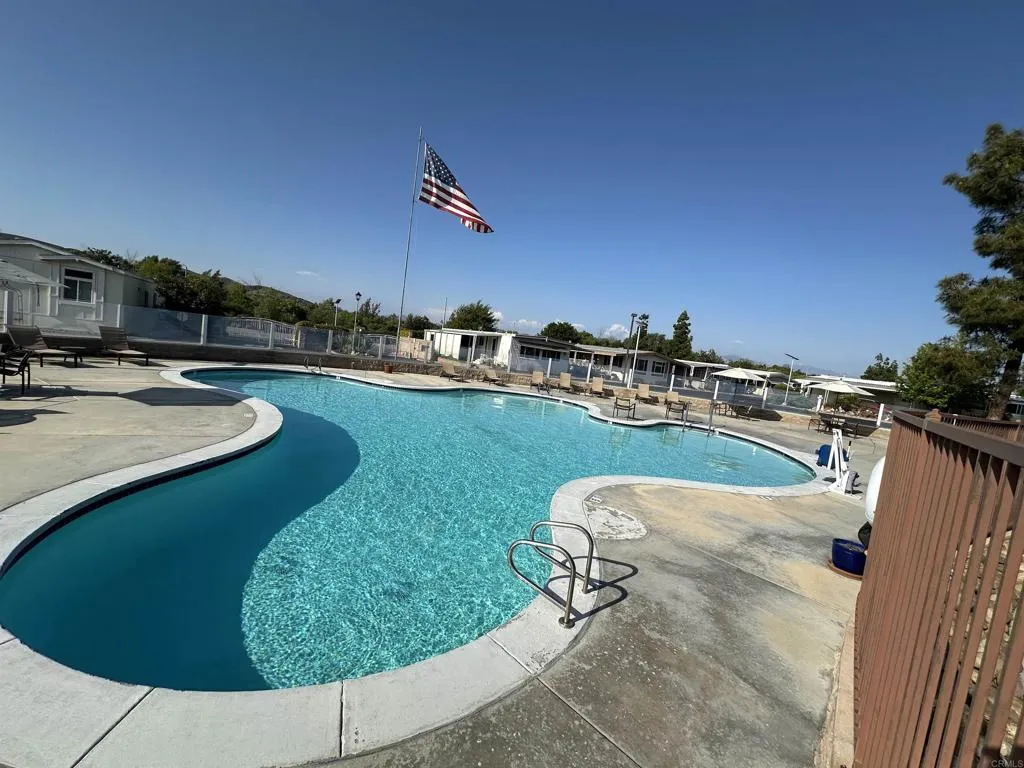 8301 Mission Gorge Road, Unit 162 Santee, CA 92071 - Photo 48 of 65 a view of a swimming pool with a yard
