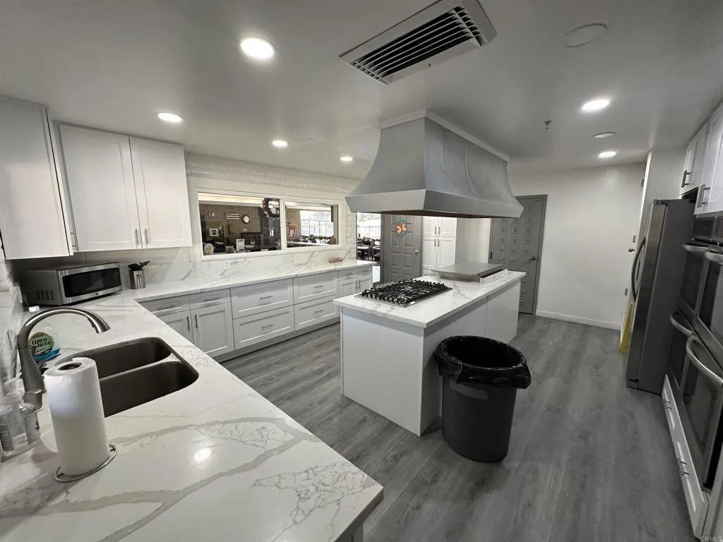 8301 Mission Gorge Road, Unit 162 Santee, CA 92071 - Photo 59 of 65 a kitchen with sink a stove and refrigerator