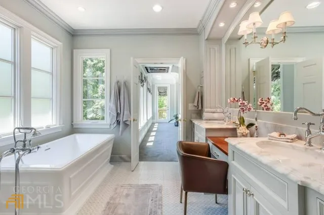 a bathroom with a tub sink and mirror