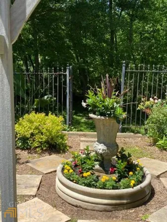 a view of a garden with a fountain