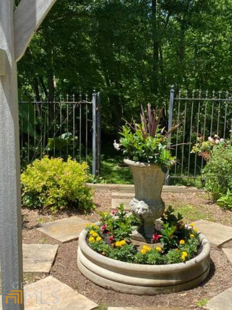 2510 Bohler Road Northwest Atlanta, GA 30327 - Photo 23 of 47 a view of a garden with a fountain