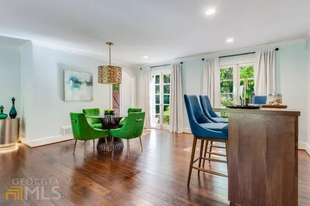 a view of a livingroom with furniture window and wooden floor