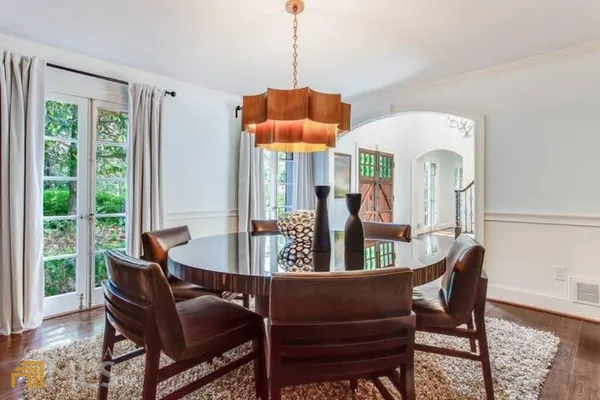 a dining room with furniture and window