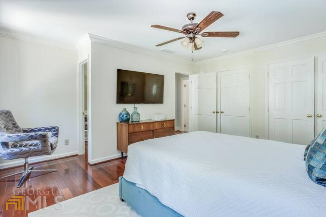 2510 Bohler Road Northwest Atlanta, GA 30327 - Photo 8 of 47 a bedroom with a bed and a flat screen tv