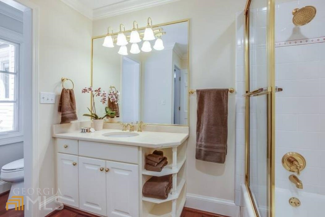 2510 Bohler Road Northwest Atlanta, GA 30327 - Photo 9 of 47 a bathroom with a sink a toilet and a mirror