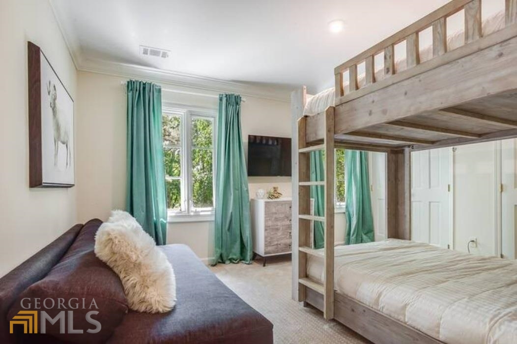 2510 Bohler Road Northwest Atlanta, GA 30327 - Photo 10 of 47 a bed sitting in a spacious bedroom next to a window