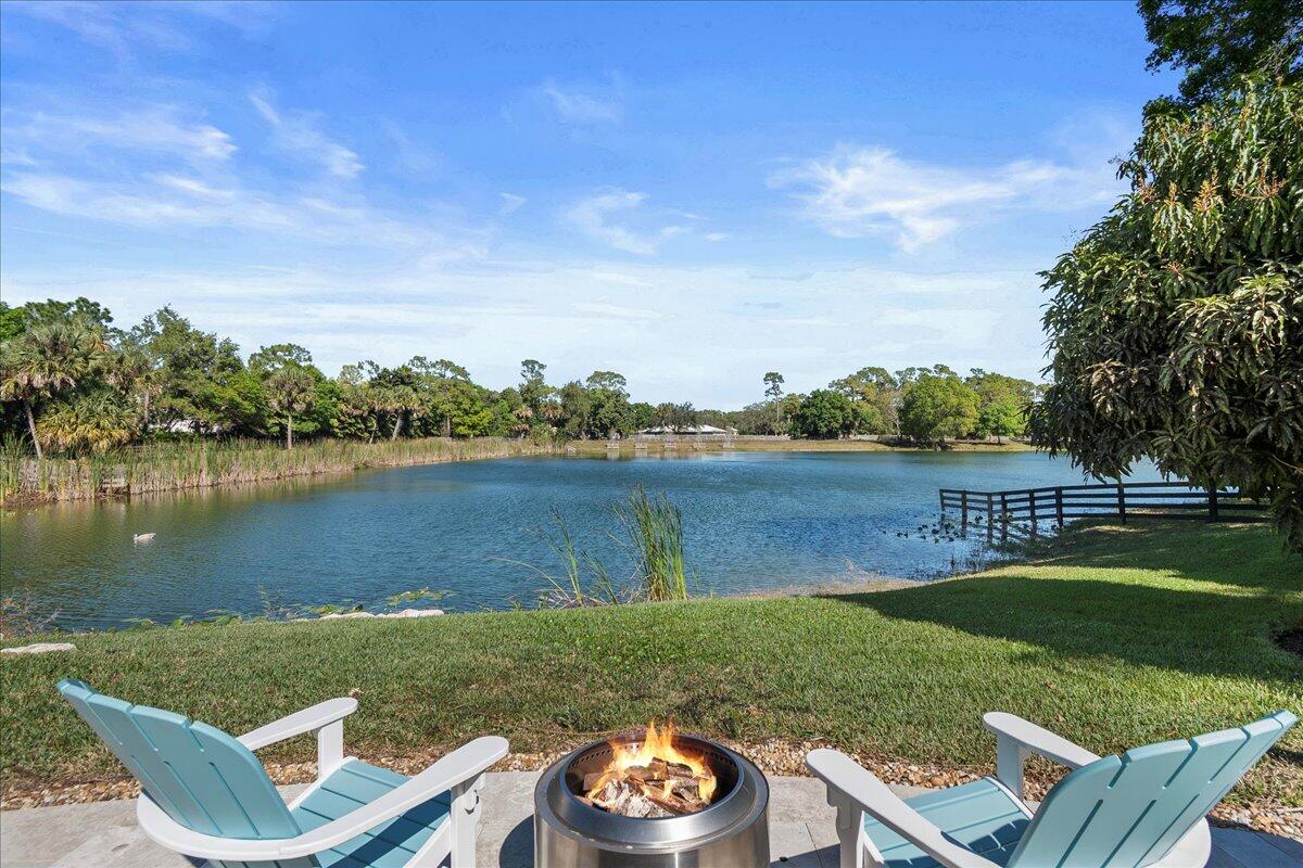 10975 Randolph Siding Road Jupiter, FL 33478 - Photo 85 of 97 a view of a lake with couches and city view