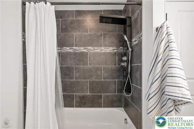 a bedroom with furniture and a baby crib