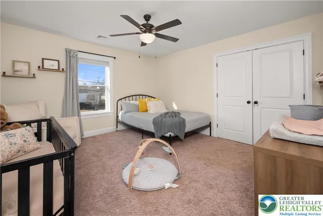 a view of a workspace with wooden floor and a window