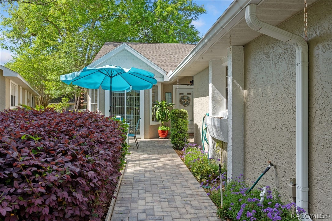 1504 North Foxboro Loop Crystal River, FL 34429 - Photo 2 of 52 Landscaped paver walk to front porch and home entry