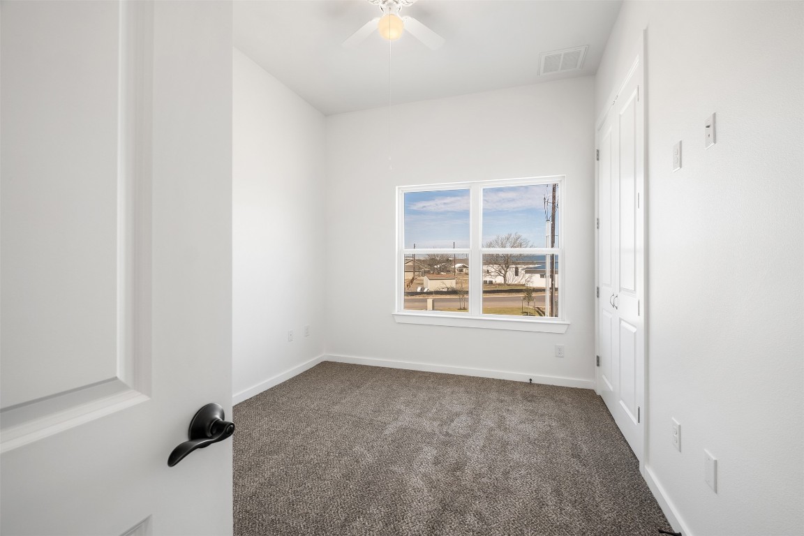 255 Lourdes Court, Unit A Dripping Springs, TX 78620 - Photo 24 of 27 an empty room with a window