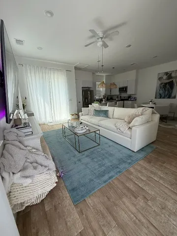 a view of kitchen with wooden floor and window