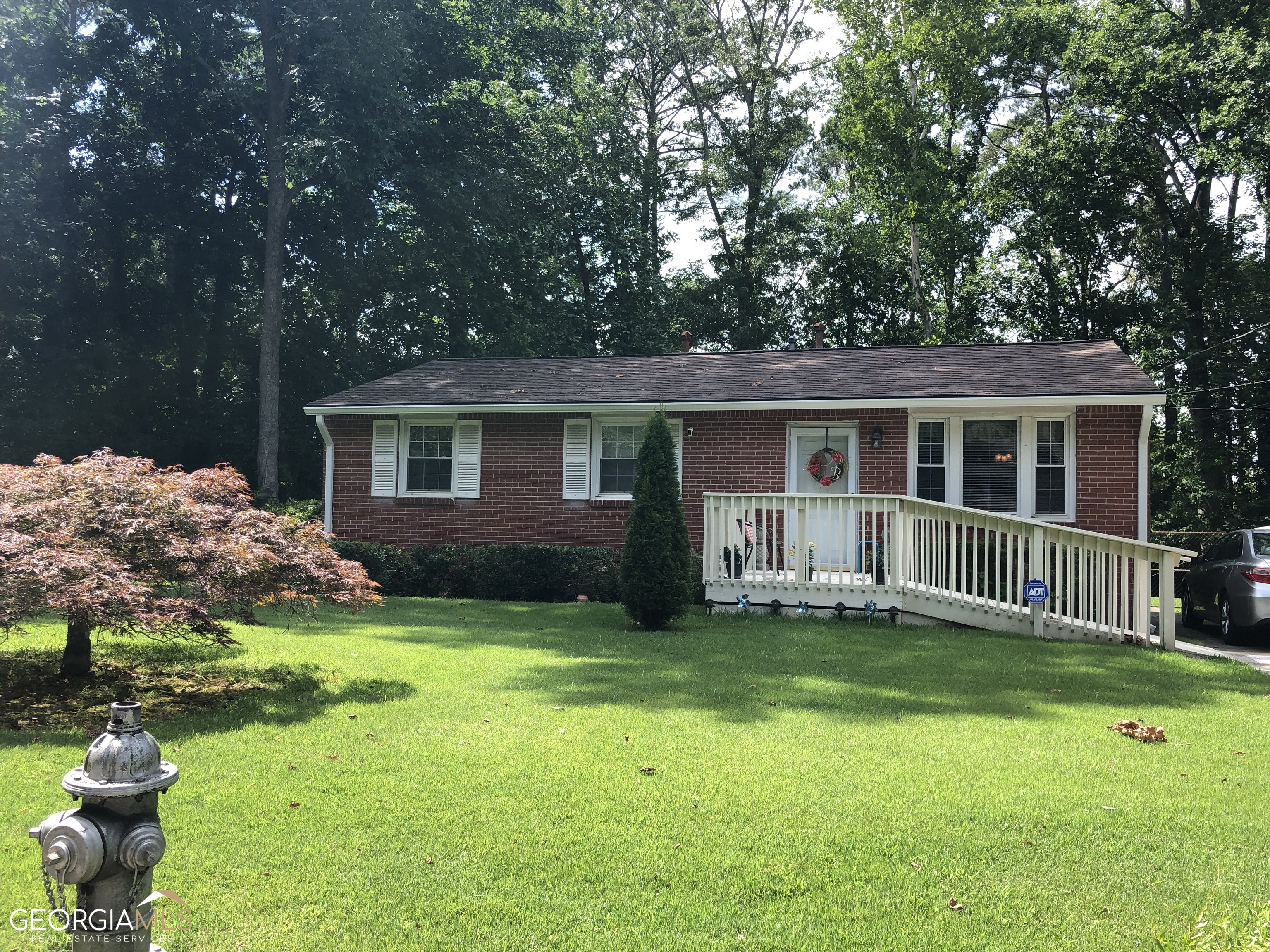 989 Fairburn Road Northwest Atlanta, GA 30331 - Photo 1 of 1 a backyard of a house with yard table and chairs