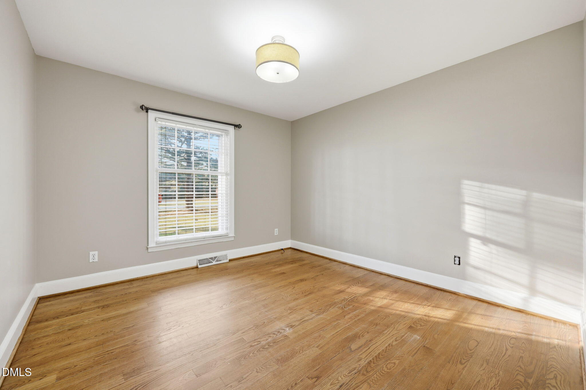 1130 Prospect Church Road Dunn, NC 28334 - Photo 30 of 47 an empty room with wooden floor and windows