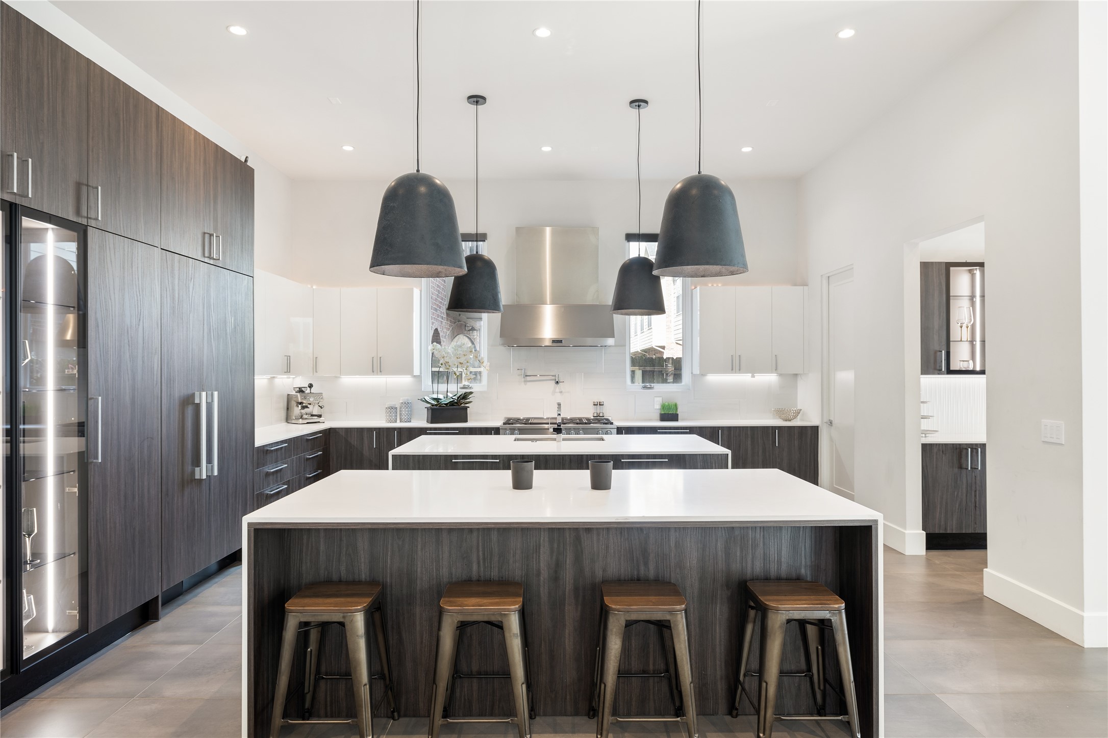 103 Roy Street Houston, TX 77007 - Photo 11 of 37 a kitchen with stainless steel appliances a table chairs and stove