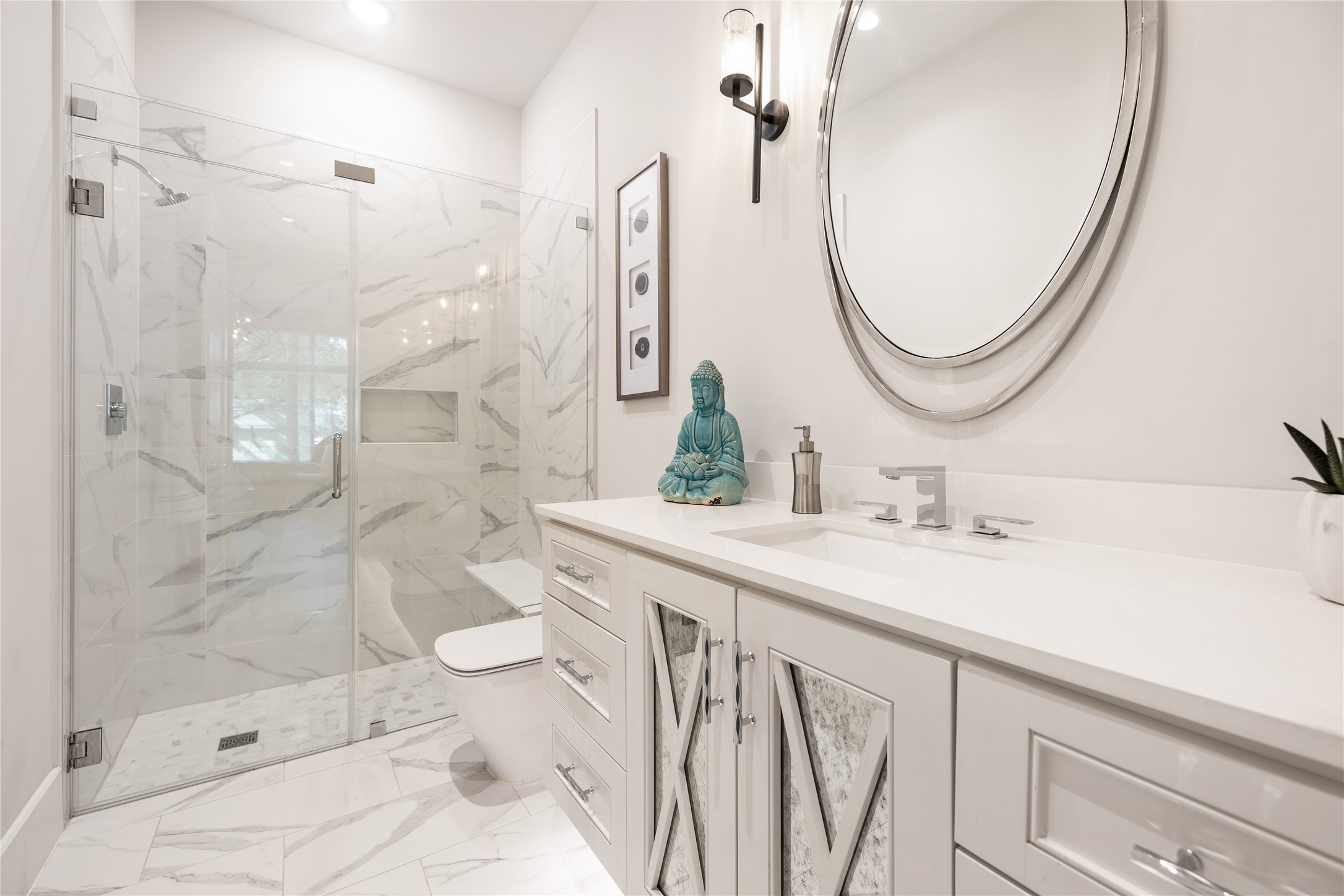 103 Roy Street Houston, TX 77007 - Photo 19 of 37 Modern bath adjacent to office featuring marble-inspired finishes, frameless glass shower enclosure, and clean-lined vanity that reflects the home’s consistent contemporary design aesthetic.