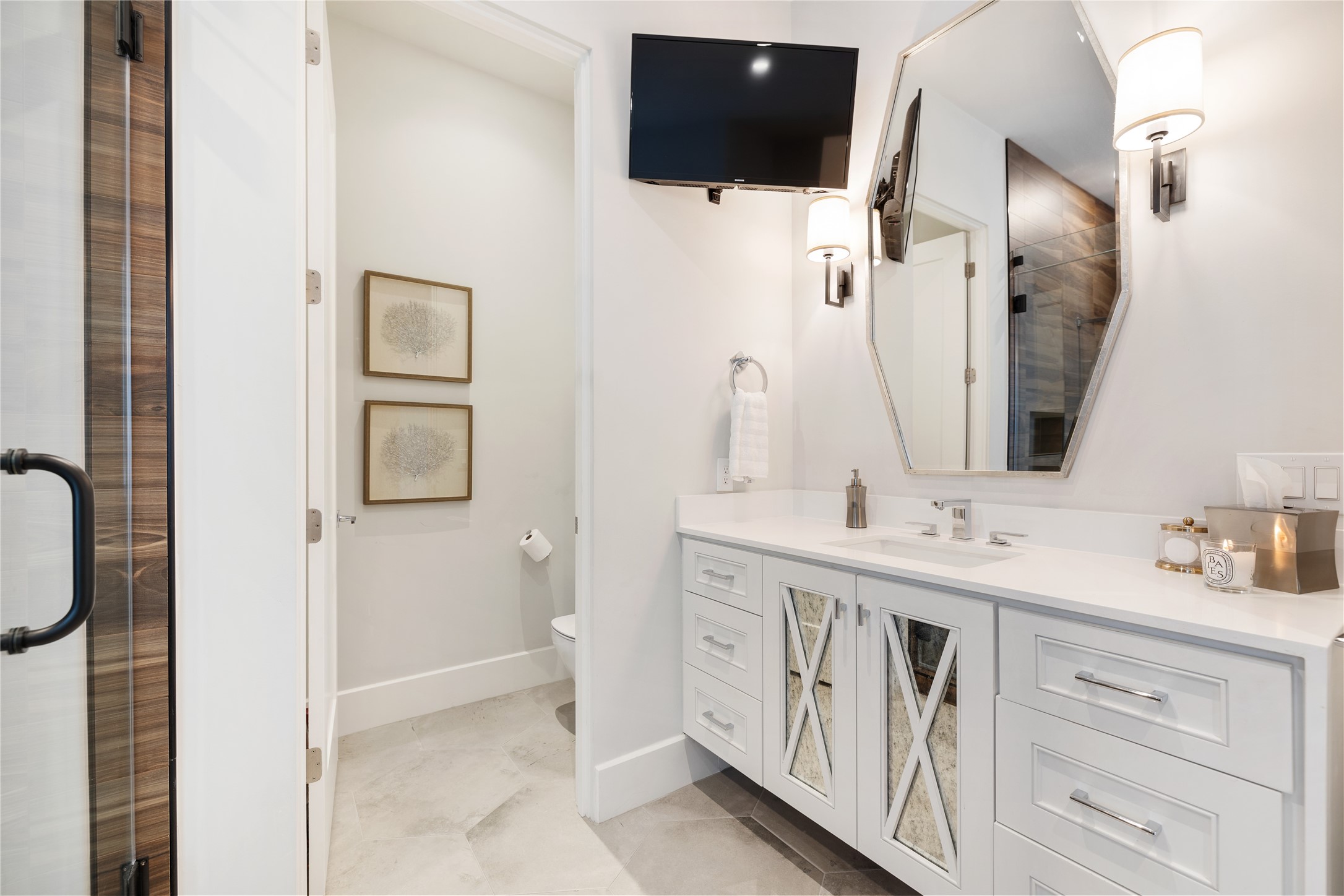 103 Roy Street Houston, TX 77007 - Photo 23 of 37 a bathroom with a double vanity sink and mirror