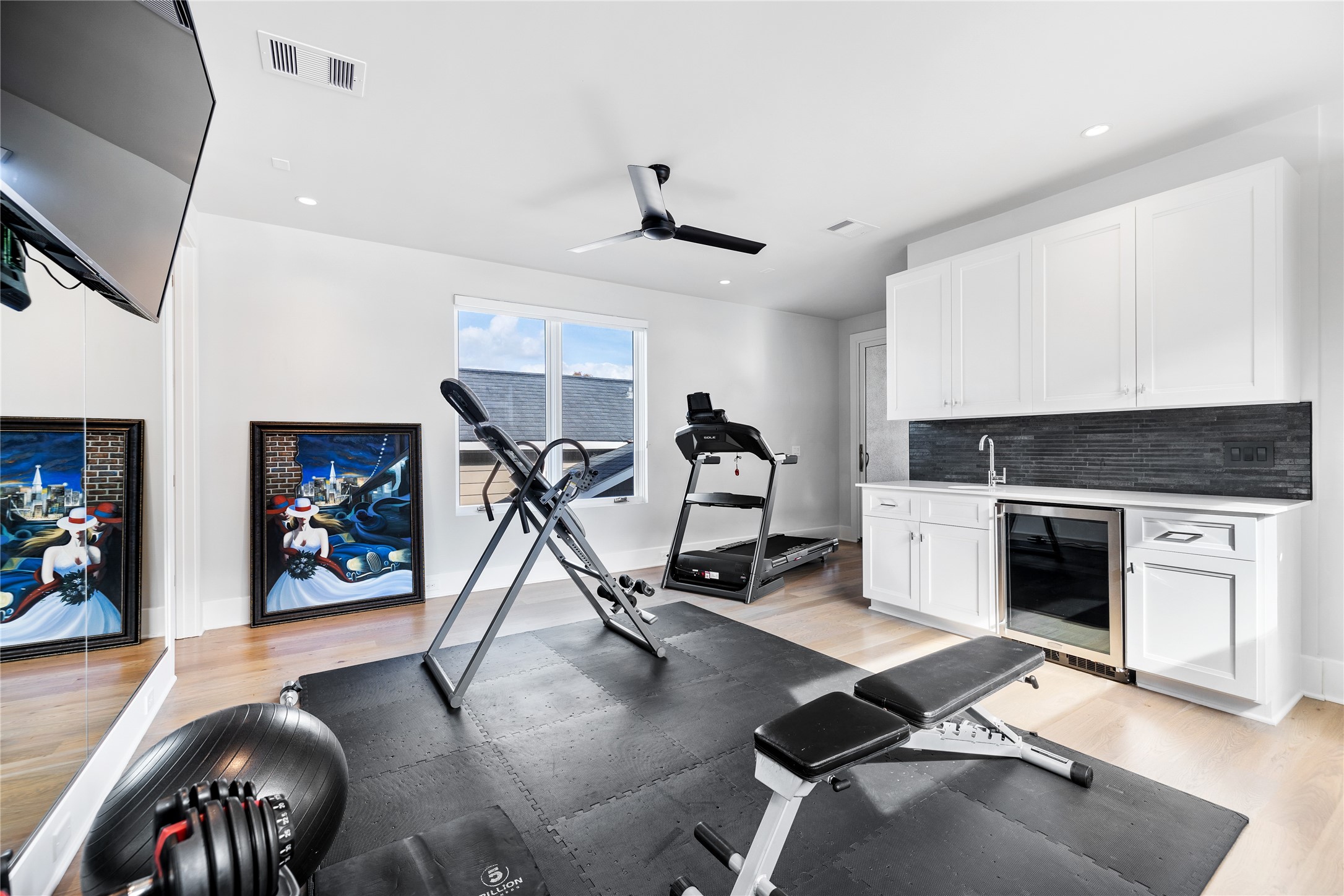 103 Roy Street Houston, TX 77007 - Photo 33 of 37 a view of a livingroom with furniture and a flat screen tv