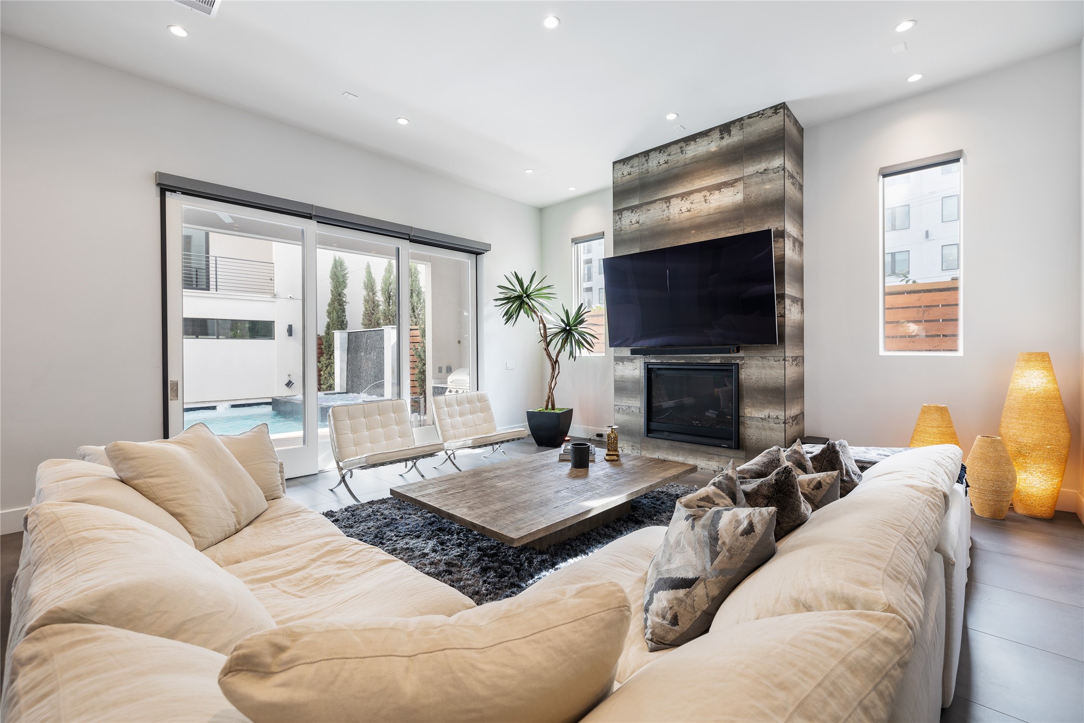 103 Roy Street Houston, TX 77007 - Photo 6 of 37 a living room with furniture a flat screen tv and a fireplace